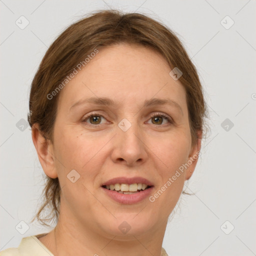 Joyful white adult female with medium  brown hair and green eyes