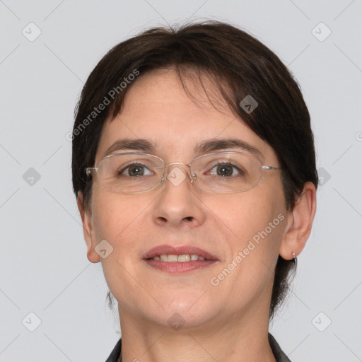 Joyful white adult female with short  brown hair and brown eyes