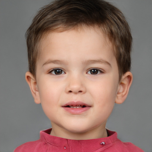 Joyful white child male with short  brown hair and brown eyes