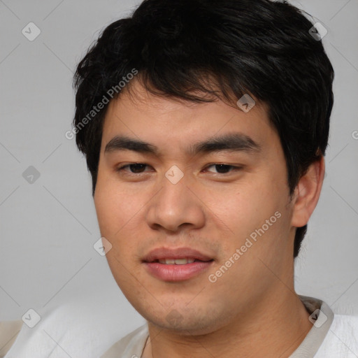 Joyful asian young-adult male with short  black hair and brown eyes