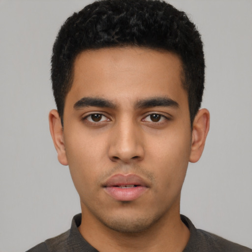Neutral latino young-adult male with short  black hair and brown eyes