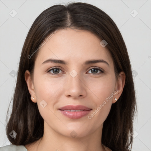 Joyful white young-adult female with long  brown hair and grey eyes