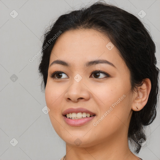 Joyful asian young-adult female with long  brown hair and brown eyes