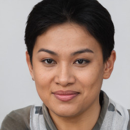 Joyful asian young-adult female with short  brown hair and brown eyes