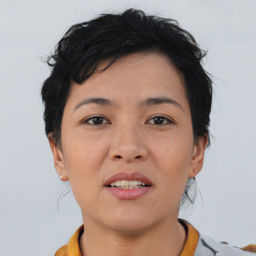 Joyful asian young-adult female with short  brown hair and brown eyes