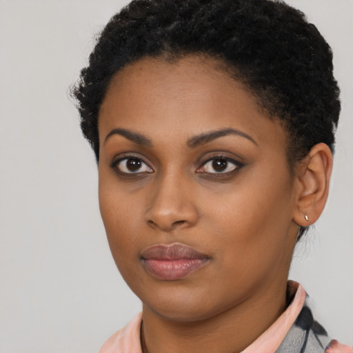 Neutral black young-adult female with short  brown hair and brown eyes
