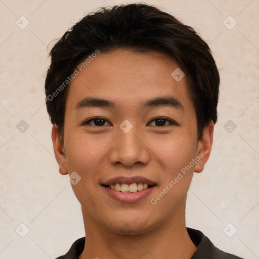 Joyful asian young-adult male with short  brown hair and brown eyes