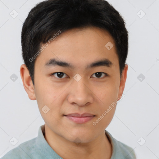 Joyful white young-adult male with short  black hair and brown eyes