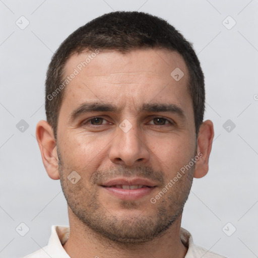 Joyful white young-adult male with short  brown hair and brown eyes