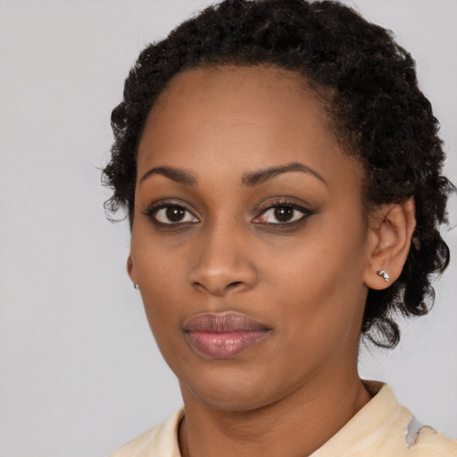 Neutral black young-adult female with medium  black hair and brown eyes