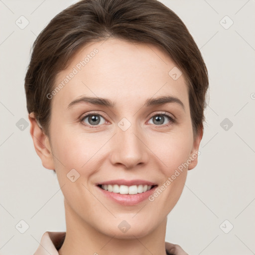 Joyful white young-adult female with short  brown hair and grey eyes