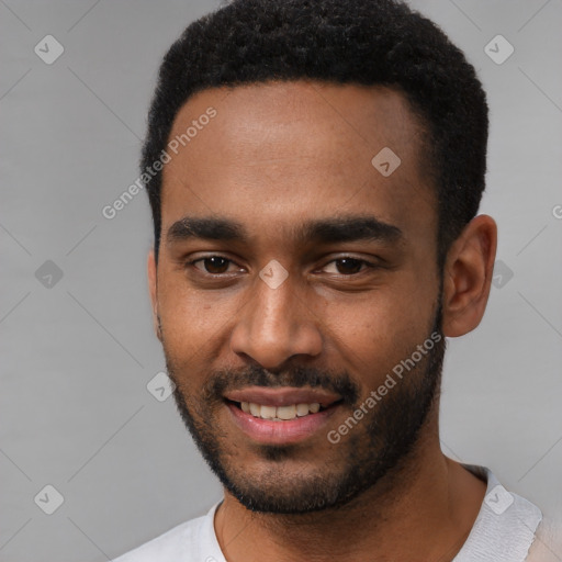 Joyful black young-adult male with short  black hair and brown eyes