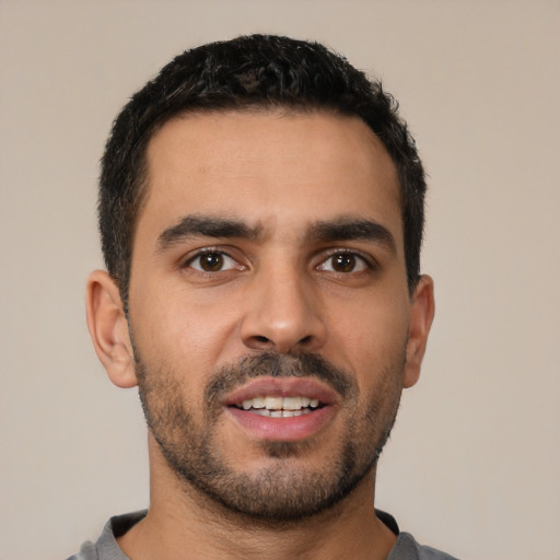 Neutral latino young-adult male with short  black hair and brown eyes