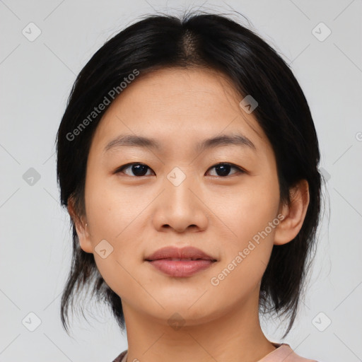 Joyful asian young-adult female with medium  black hair and brown eyes