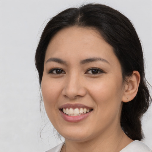 Joyful asian young-adult female with medium  brown hair and brown eyes