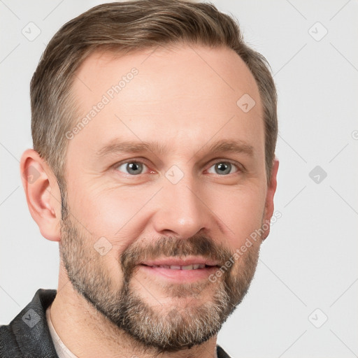 Joyful white adult male with short  brown hair and grey eyes