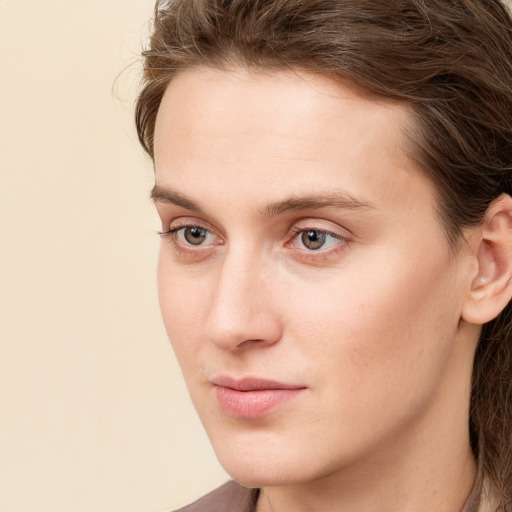 Neutral white young-adult male with long  brown hair and grey eyes