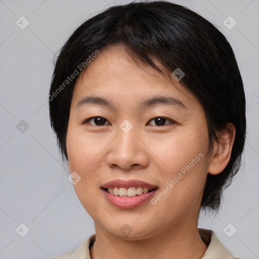 Joyful asian young-adult female with medium  brown hair and brown eyes