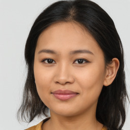 Joyful asian young-adult female with long  brown hair and brown eyes