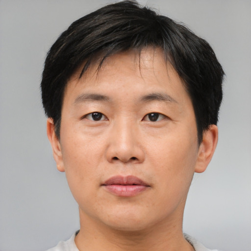 Neutral asian young-adult male with short  black hair and brown eyes