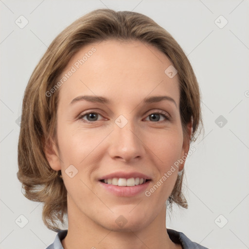 Joyful white adult female with medium  brown hair and grey eyes