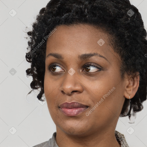 Joyful black young-adult female with medium  black hair and brown eyes