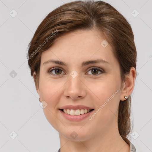 Joyful white young-adult female with medium  brown hair and grey eyes