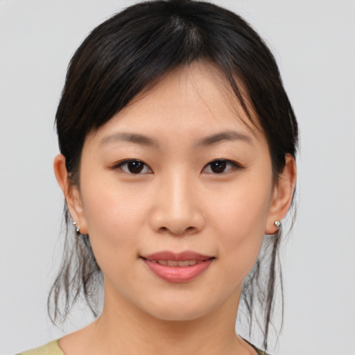 Joyful asian young-adult female with medium  brown hair and brown eyes