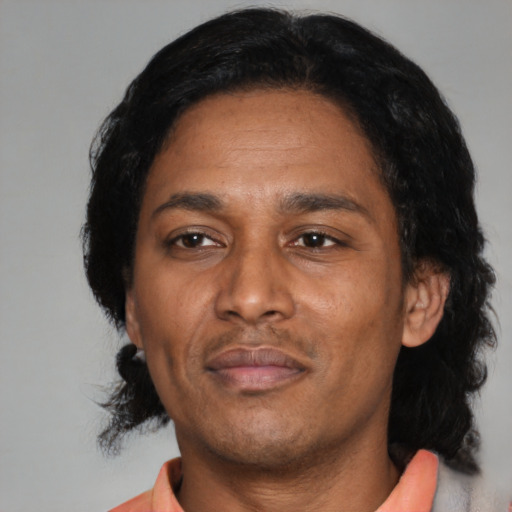 Neutral latino adult male with short  black hair and brown eyes