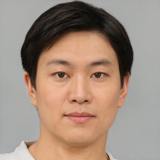 Neutral asian young-adult male with short  brown hair and brown eyes