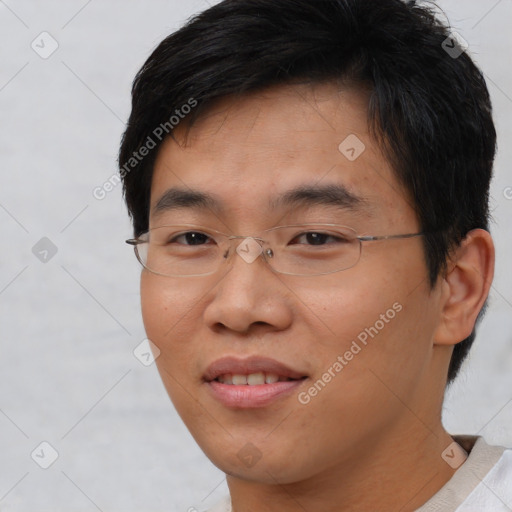 Joyful asian young-adult male with short  brown hair and brown eyes