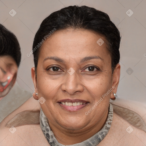 Joyful latino adult female with short  brown hair and brown eyes