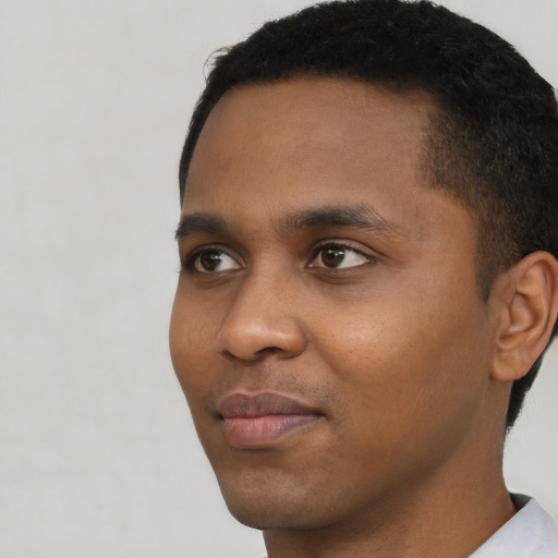 Neutral black young-adult male with short  black hair and brown eyes