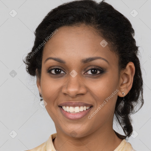 Joyful black young-adult female with medium  brown hair and brown eyes