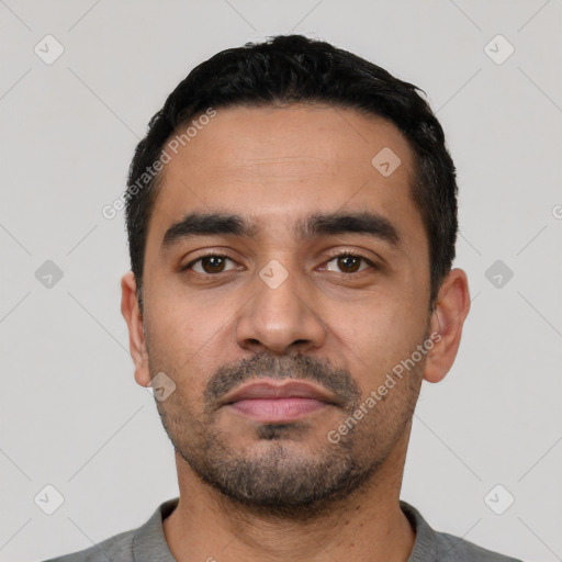 Neutral latino young-adult male with short  black hair and brown eyes