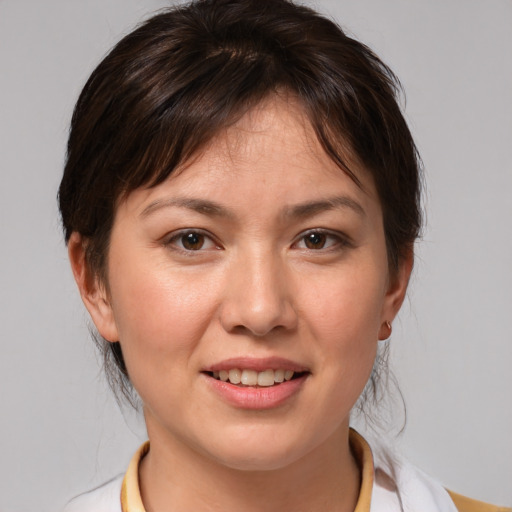 Joyful white adult female with medium  brown hair and brown eyes