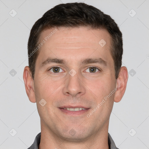 Joyful white adult male with short  brown hair and grey eyes