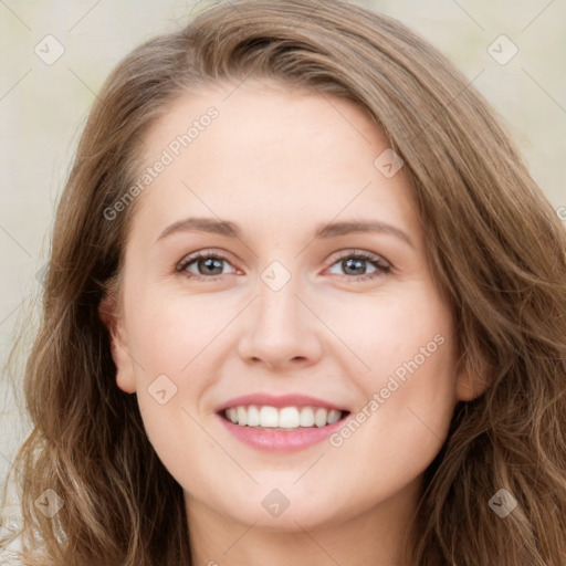 Joyful white young-adult female with long  brown hair and green eyes