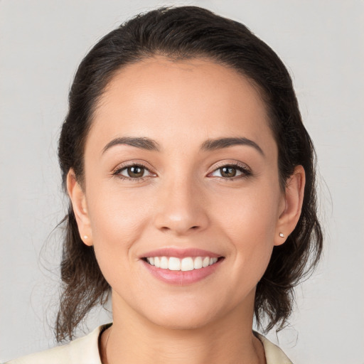 Joyful white young-adult female with medium  brown hair and brown eyes