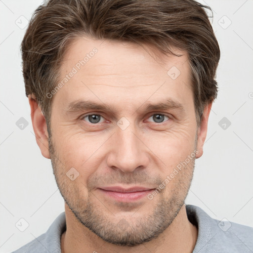 Joyful white adult male with short  brown hair and grey eyes