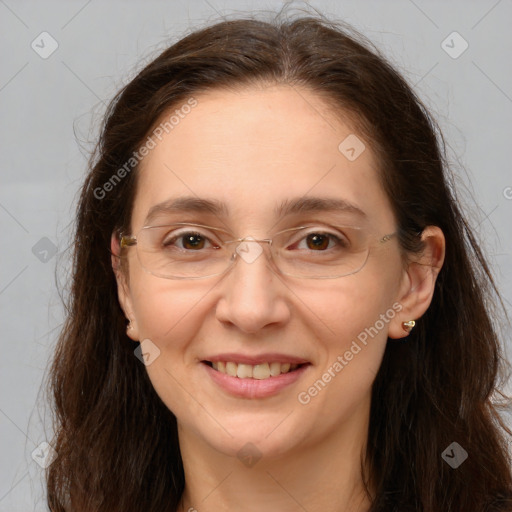 Joyful white adult female with long  brown hair and brown eyes