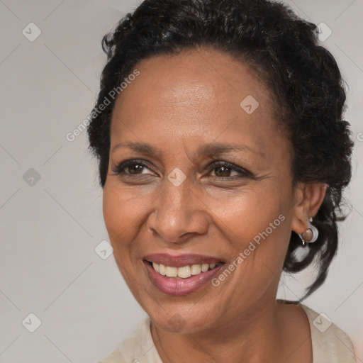 Joyful black adult female with medium  brown hair and brown eyes