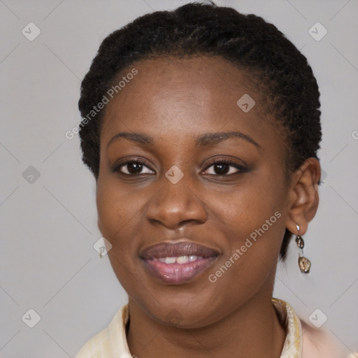 Joyful black young-adult female with short  brown hair and brown eyes