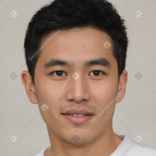 Joyful asian young-adult male with short  black hair and brown eyes