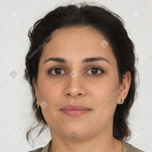 Joyful latino young-adult female with medium  brown hair and brown eyes