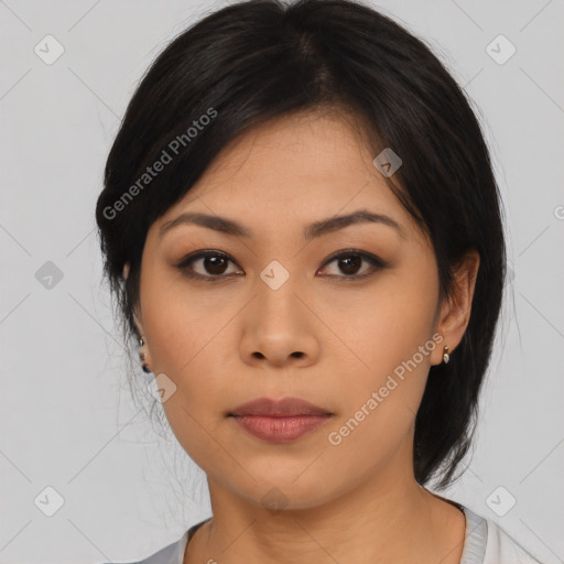 Joyful asian young-adult female with medium  black hair and brown eyes