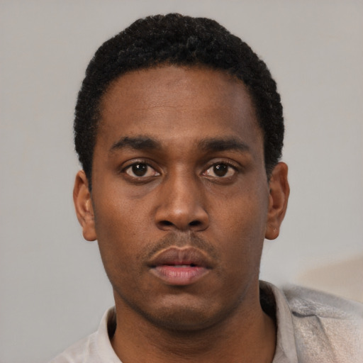 Neutral black young-adult male with short  black hair and brown eyes