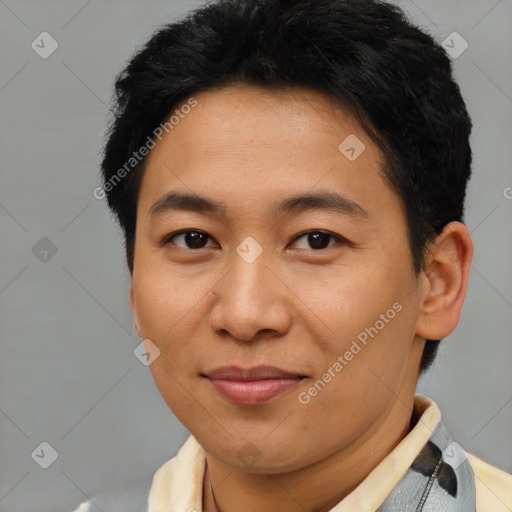 Joyful asian young-adult male with short  brown hair and brown eyes