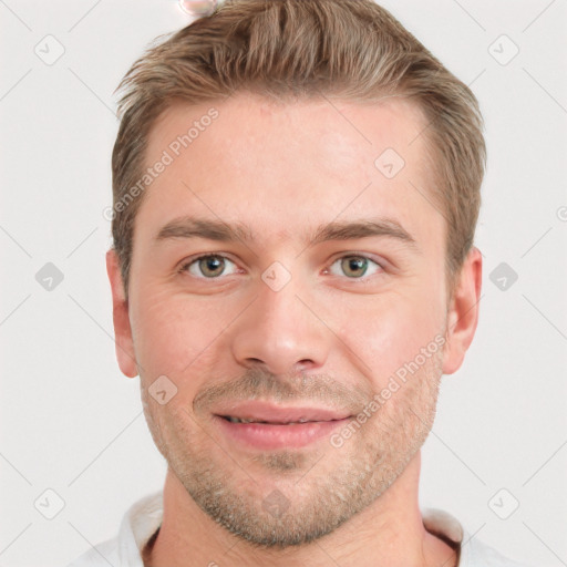 Joyful white young-adult male with short  brown hair and grey eyes