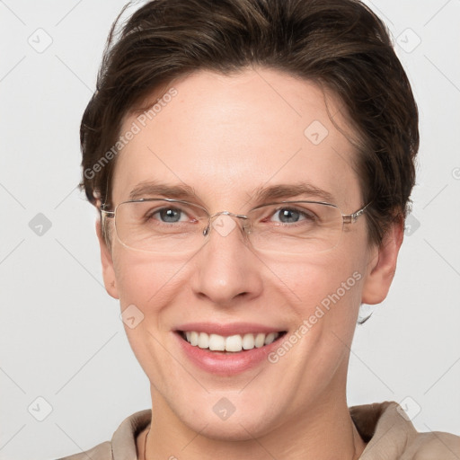 Joyful white adult female with short  brown hair and grey eyes